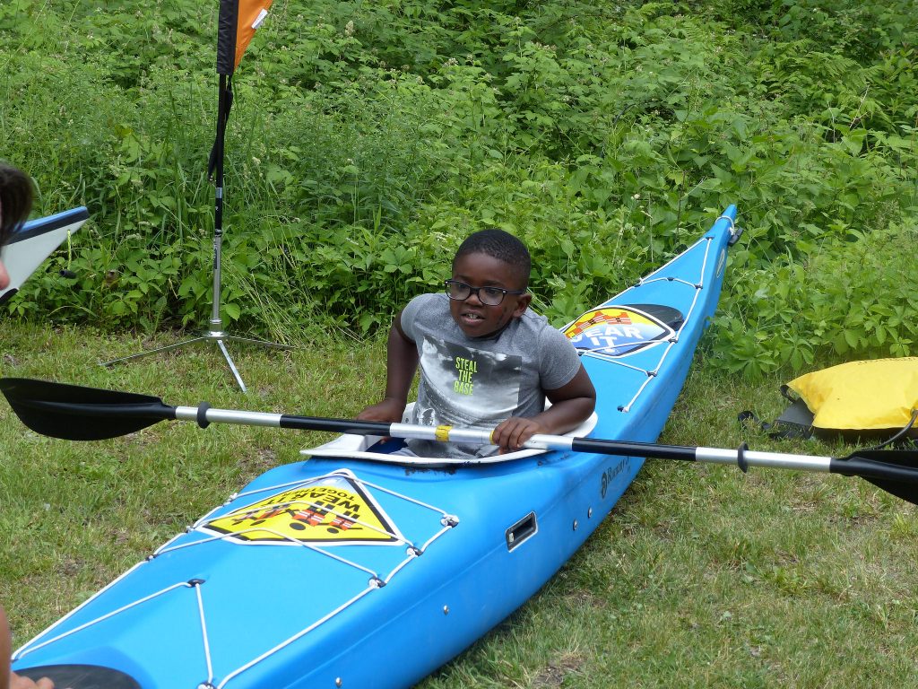 outdoor day - boy in kayak