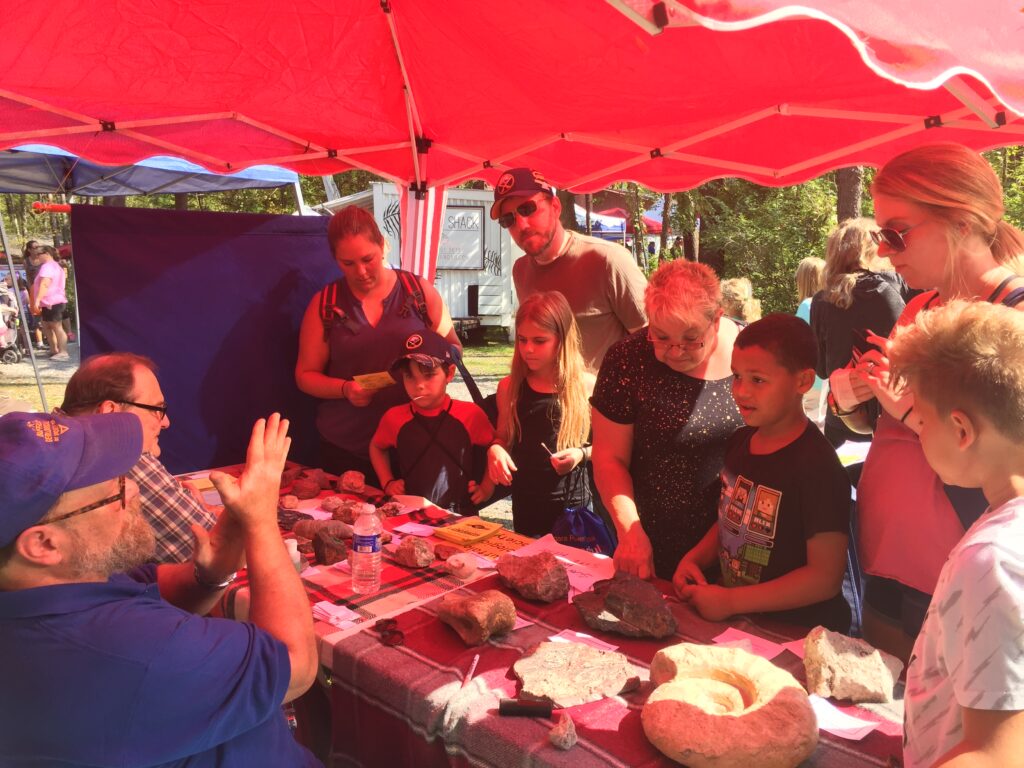 Fall festival - family looking at gems and minerals