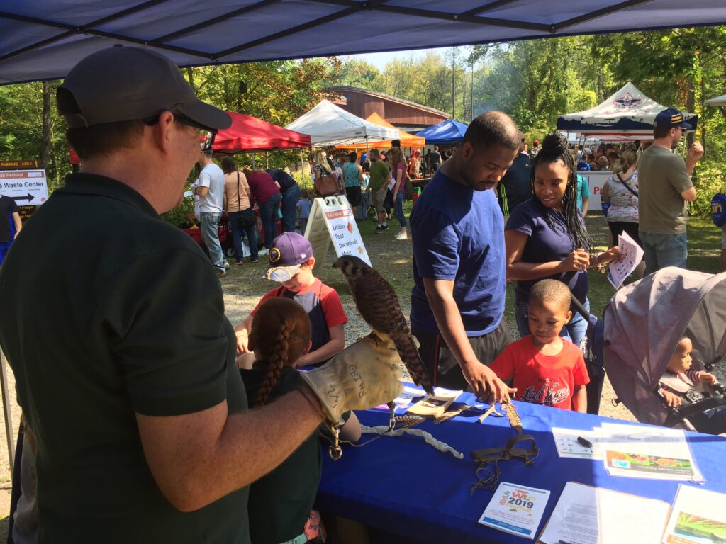 Fall festival - family with birds of prey